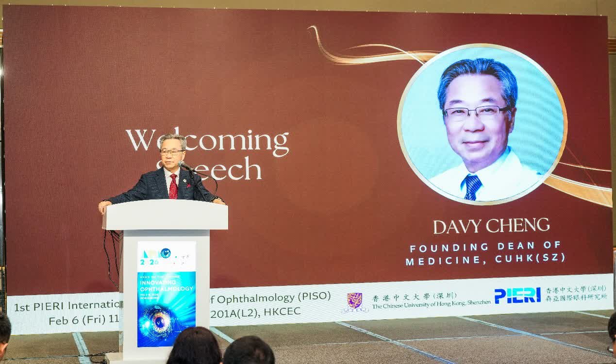 Professor Davy Cheng, Founding Dean of Medicine at CUHK (SZ), delivering remarks at the PIERI symposium with the institute's name on the backdrop.